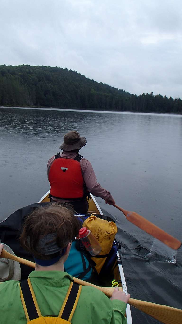 Canoeing under light rain